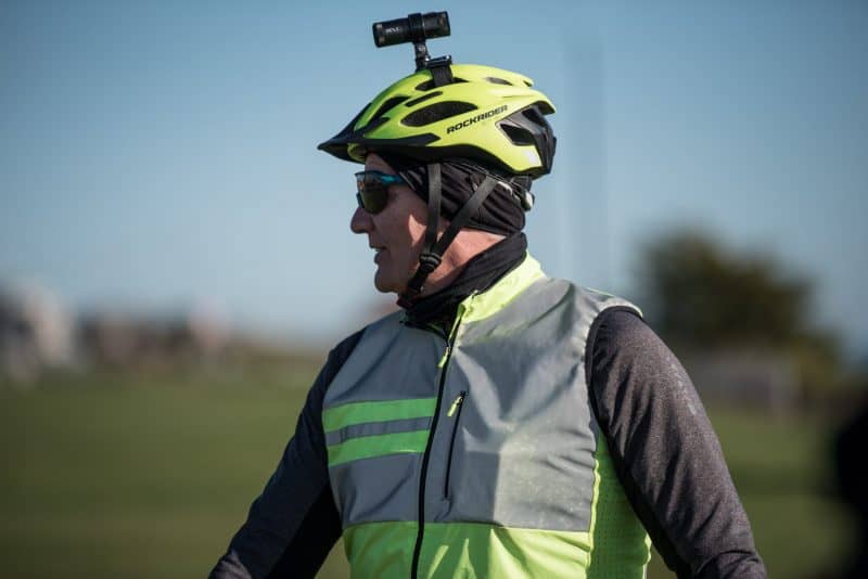 Man with green helmet wearing XV-1 2K QHD Helmet Camera