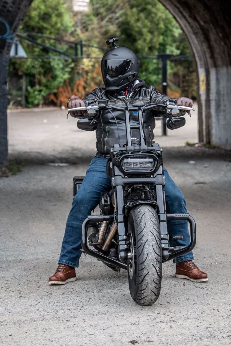 Man sitting on Motorcycle with the DC-1 Dual Lens Helmet Camera