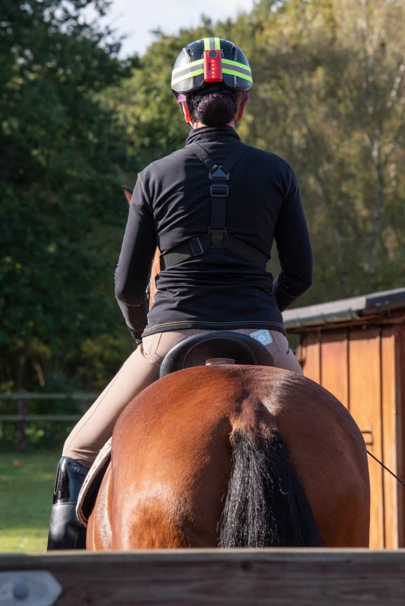 Woman riding horse with CR-1 REAR LIGHT attached