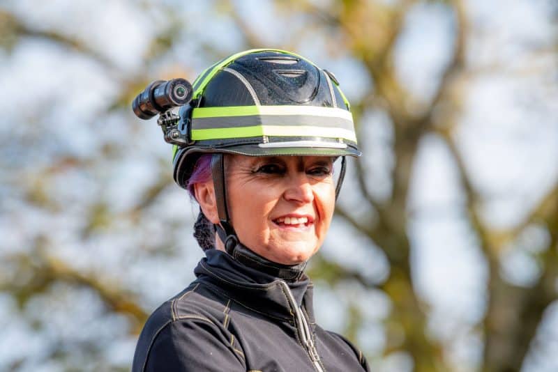 Woman wearing Equestrian helmet camera DC-1 Dual Lens Helmet Camera