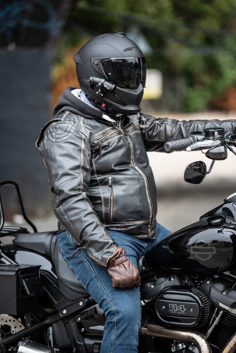 Man sitting on motorbike withDC-1 Dual Lens Helmet Camera