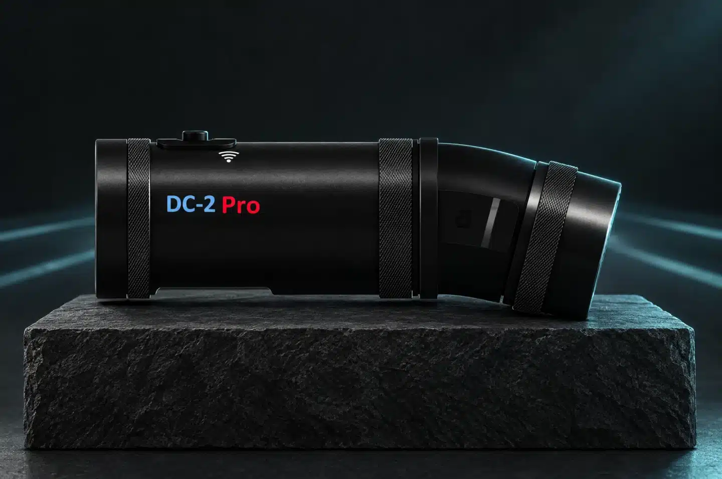 DC-2 Pro camera on a charcoal plinth with subtle teal lighting