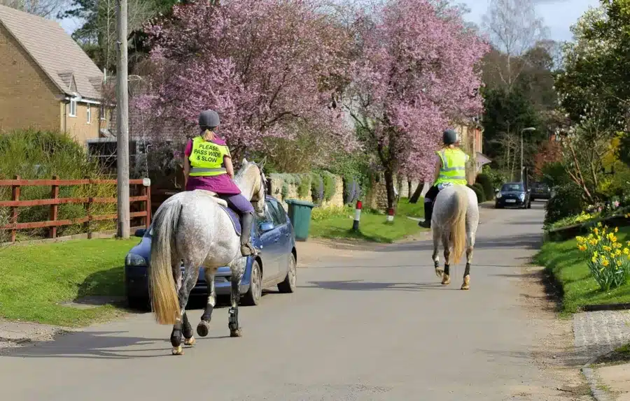 Horse riders with Techalogic DC-2 camera system mounted on riding helmet