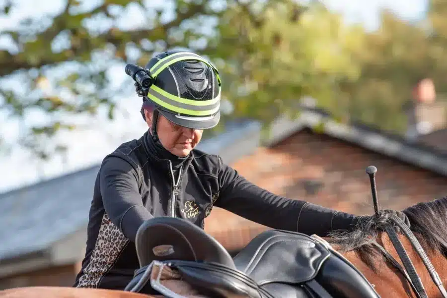 Horse rider with a camera on their riding hat
